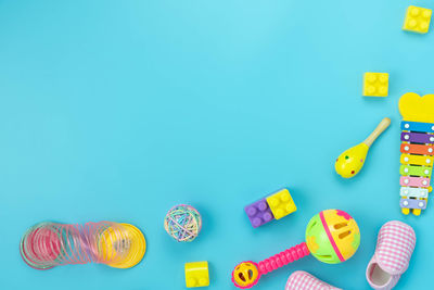 High angle view of toys against blue background