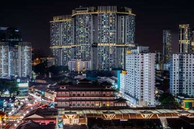 Illuminated buildings in city at night