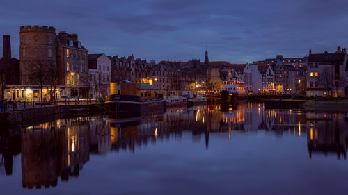 Reflection of illuminated buildings in water