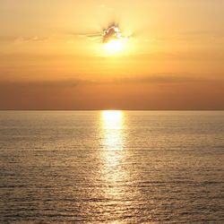 Scenic view of sea at sunset