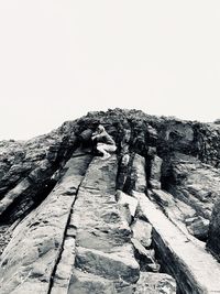 Low angle view of rock formation against clear sky