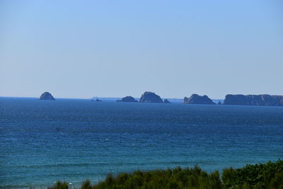 Scenic view of sea against clear blue sky