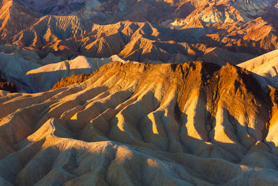 High angle view of sun shining over mountain