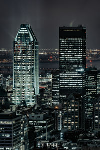 Illuminated buildings in city at night