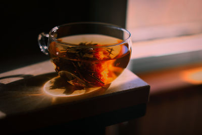 Close-up of herbal tea in cup on table