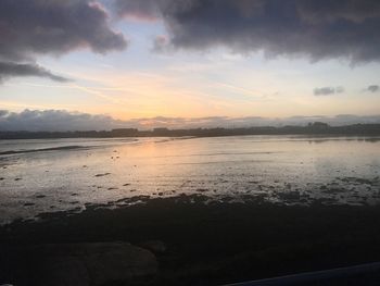 Scenic view of sea against sky at sunset