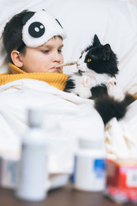 Full length of woman with cat