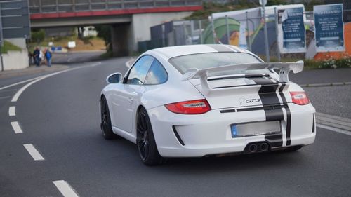 Close-up of car on road