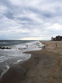 Scenic view of sea against cloudy sky