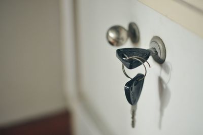 Keyhole with key in wooden drawer