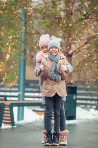 Full length portrait of smiling girl