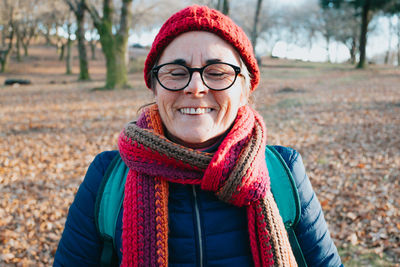 Woman wearing knit hat standing on field