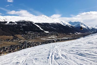 Scenic view of snowcapped mountains against sky