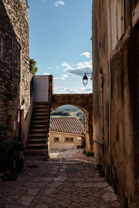 Alley amidst buildings in city