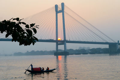 Hooghly bridge during sunset over ganges river kolkata and howrah. 