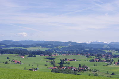 Scenic view of landscape against cloudy sky