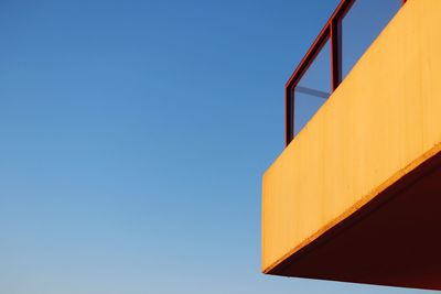 Low angle view of built structure against clear blue sky