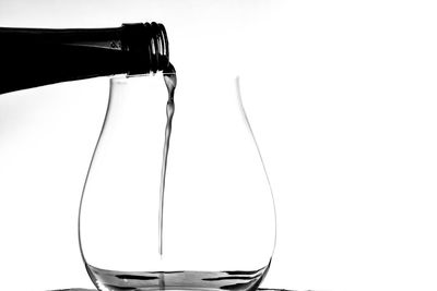 Close-up of glass bottle against white background