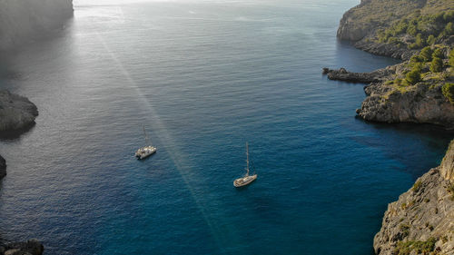 High angle view of sailboats in sea