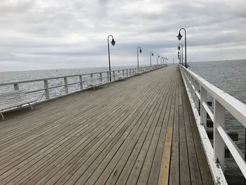 Pier over sea against sky