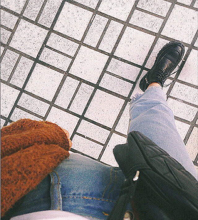 high angle view, shadow, low section, tiled floor, street, sidewalk, sunlight, paving stone, footpath, day, person, cobblestone, pattern, outdoors, tile, flooring, shoe, personal perspective