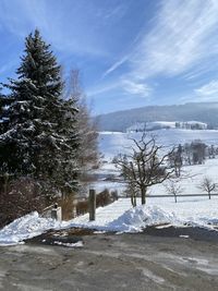 Scenic view of snow covered mountains against sky