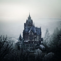 View of buildings against sky during winter