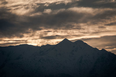 Scenic view of mountains against dramatic sky