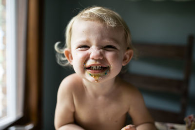Toddler girl smiling after eating sweet treat