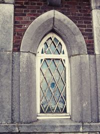 Close-up of window on brick wall