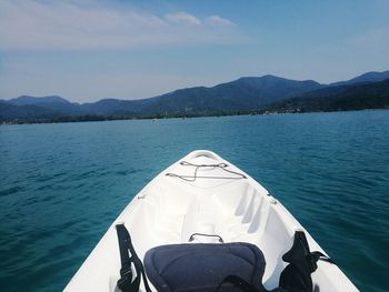 Boat sailing in lake against sky