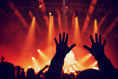 Cropped hands of man in music concert