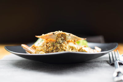 Close-up of food served on table