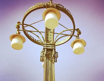 Low angle view of illuminated lamp against clear sky