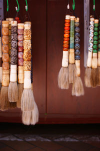 Close-up of multi colored brushes on table