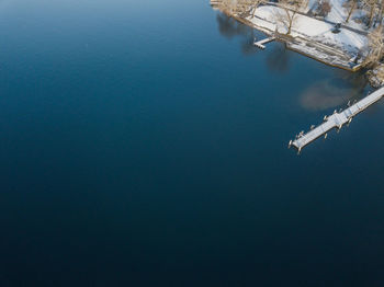 High angle view of sea against blue sky