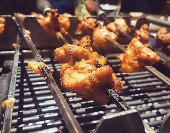 Close-up of meat on barbecue grill