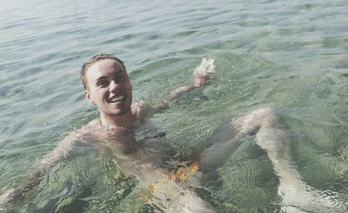 Woman jumping in sea