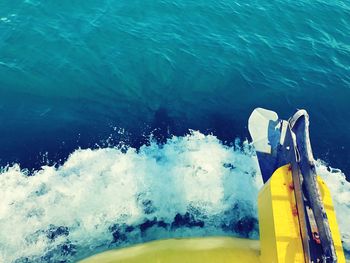 Close-up of yellow water splashing in sea