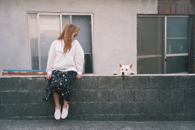 Full length of woman with dog