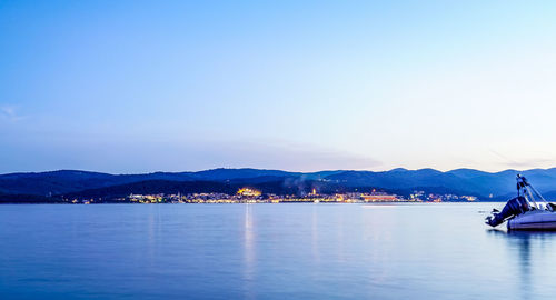 Scenic view of sea against clear blue sky