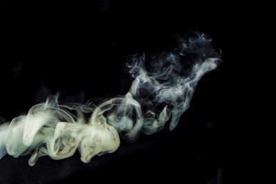 Close-up of lamp over black background