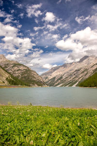 Scenic view of lake and mountains against sky