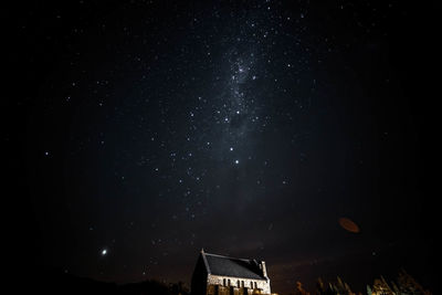 Low angle view of building against sky at night