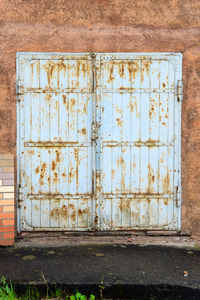 Old rusty door of abandoned building