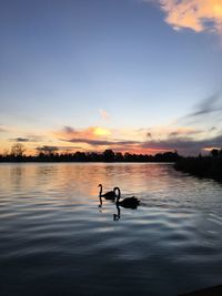Scenic view of sunset over lake