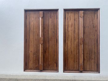 Close-up of closed wooden door of building