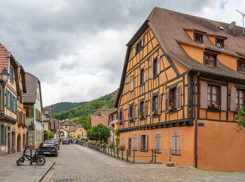 Buildings in city against sky