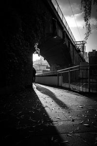 Footpath amidst buildings against sky