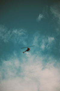 Low angle view of airplane flying in sky